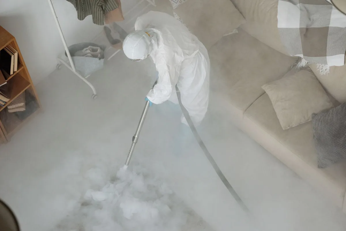 Biohazard cleanup technician in protective equipment, Downtown, Boston, MA